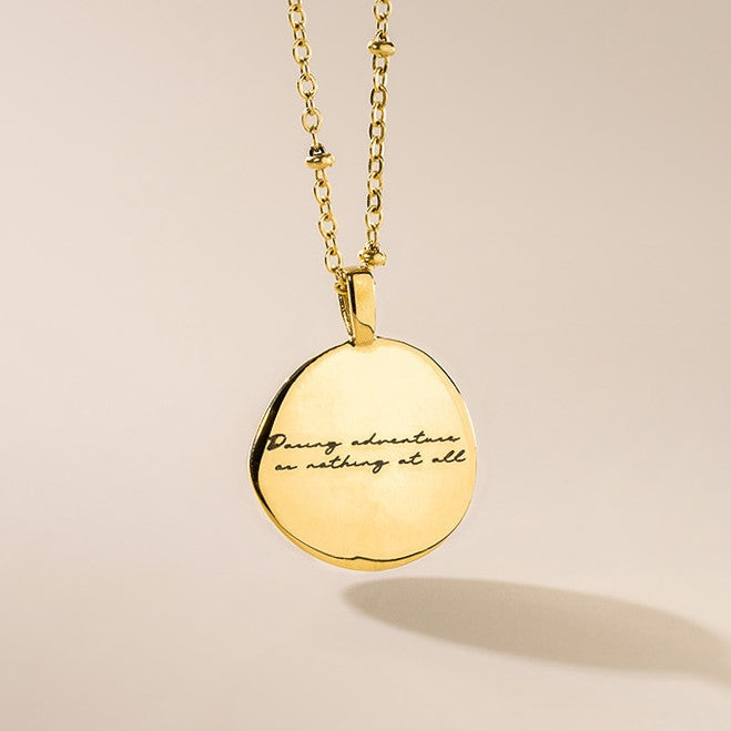 The back of the compass pendant