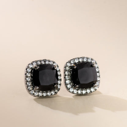 A pair of black vintage cushion stud earrings with a sparkling border and a secure fastening.