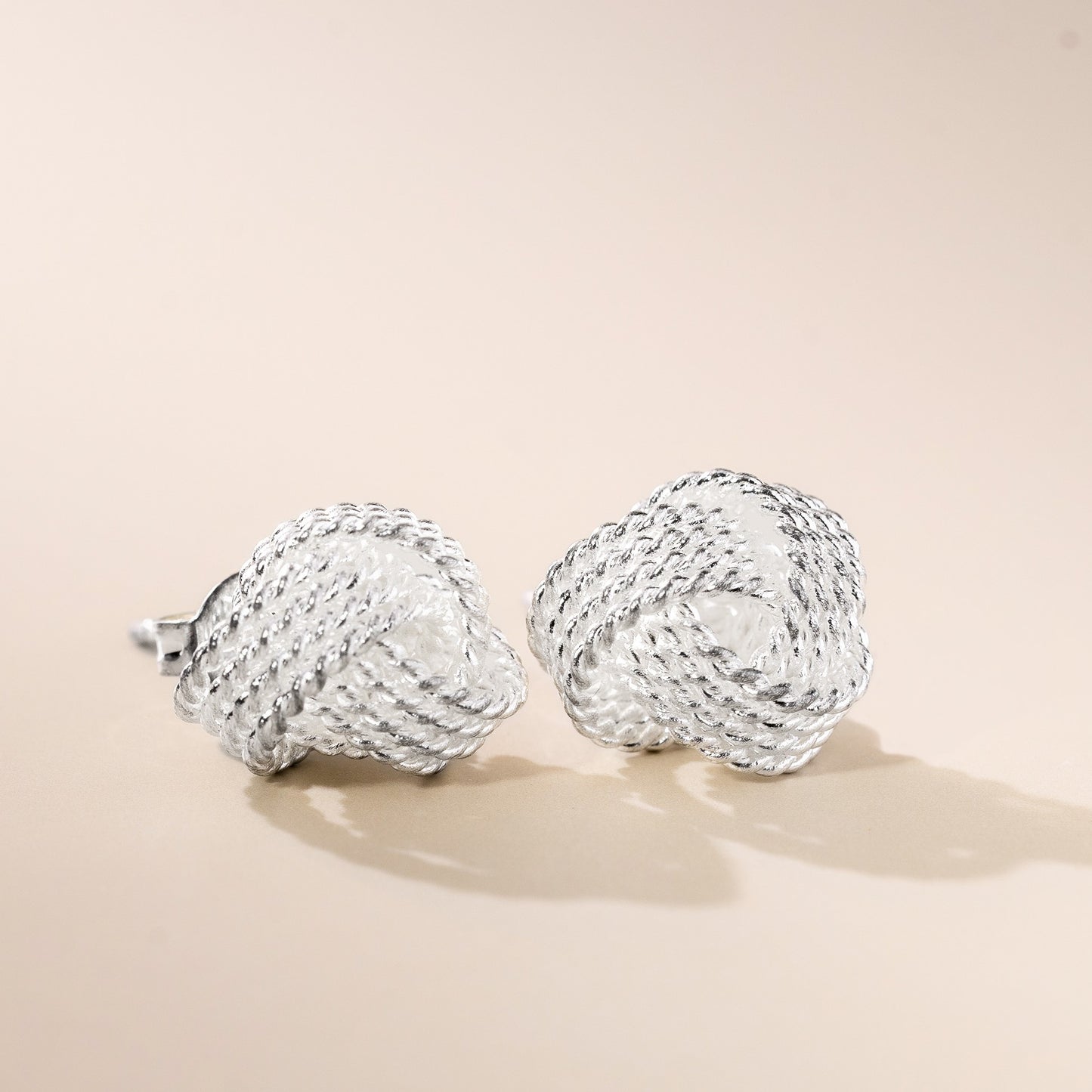 Tennis knot silver earrings