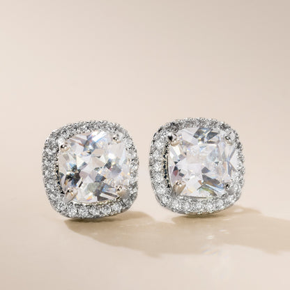 A pair of sterling silver cushion cubic zirconia stud earrings with a scattering of high-quality cubic zirconia stones.