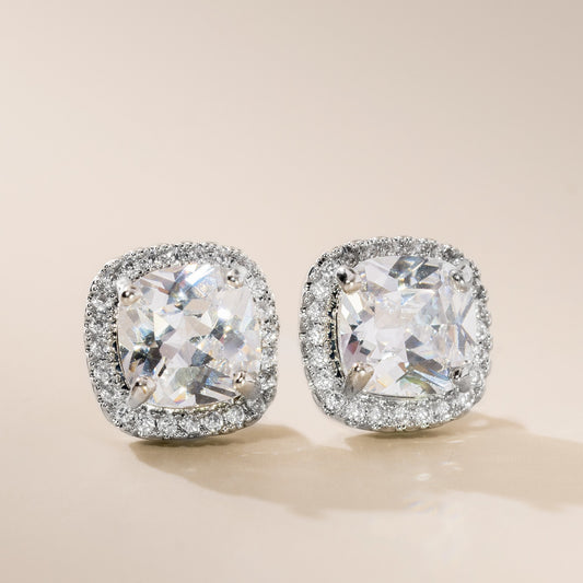 A pair of sterling silver cushion cubic zirconia stud earrings with a scattering of high-quality cubic zirconia stones.
