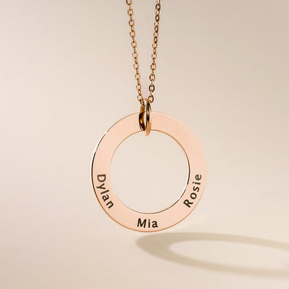 A rose gold washer pendants with names engraved