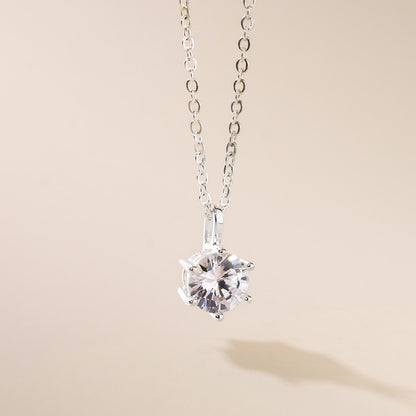 A silver-colored necklace featuring a cubic zirconia pendant at the center, with a classic design and a length of 45cm.