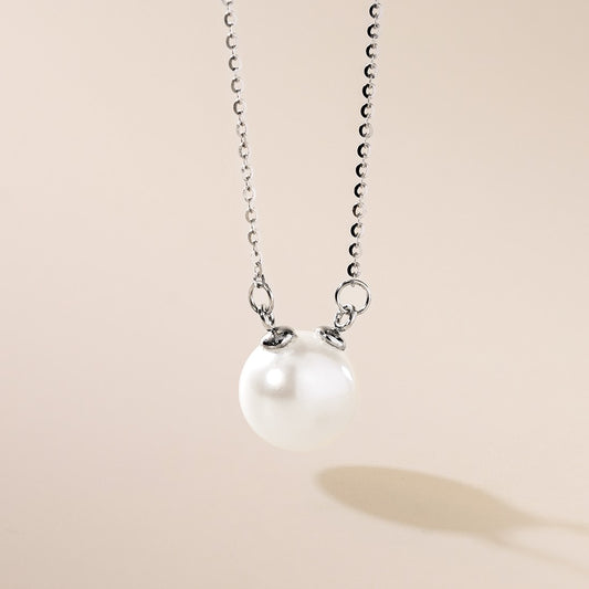 A sterling silver freshwater pearl necklace with a pearl pendant, displayed against a neutral background.