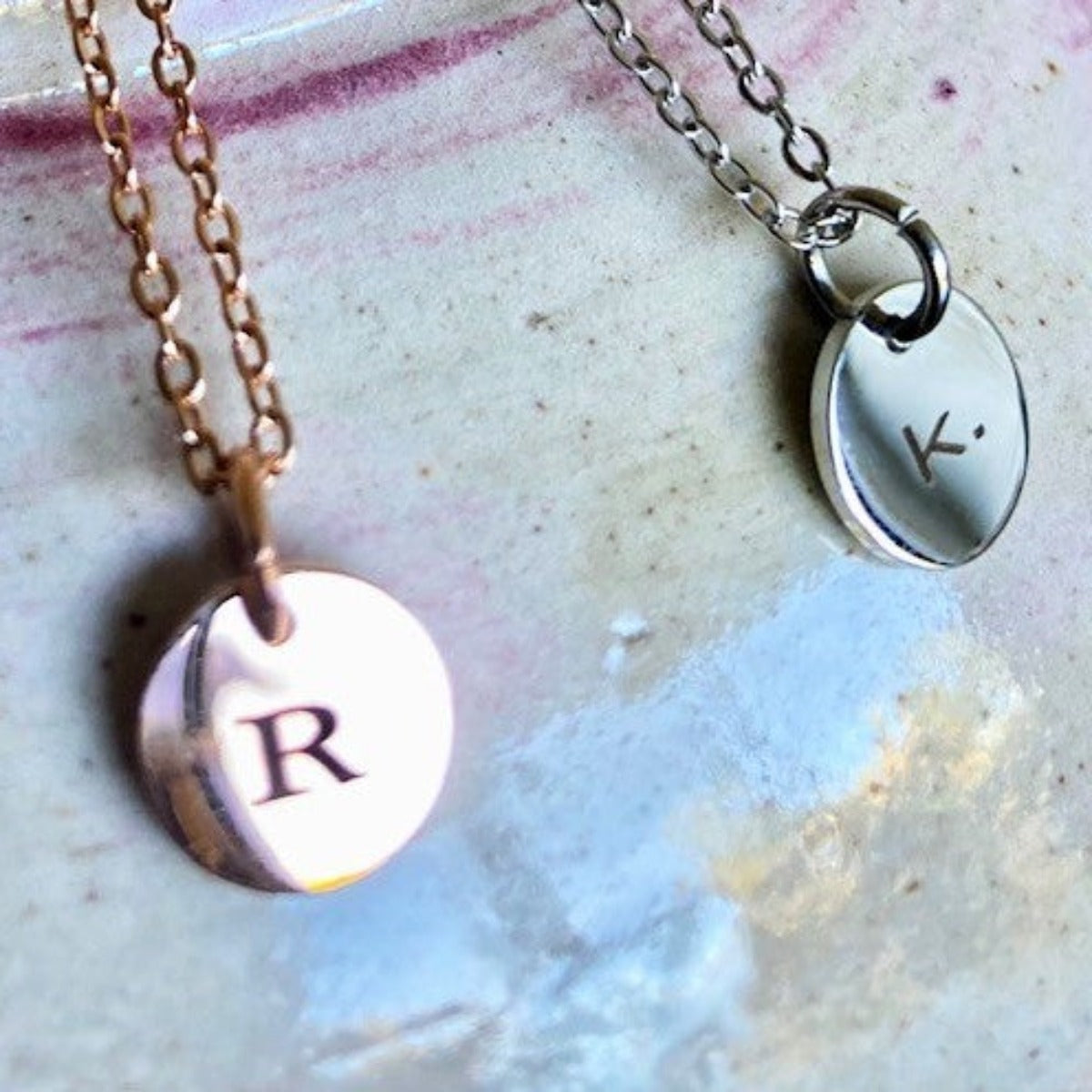 Two initial pendants