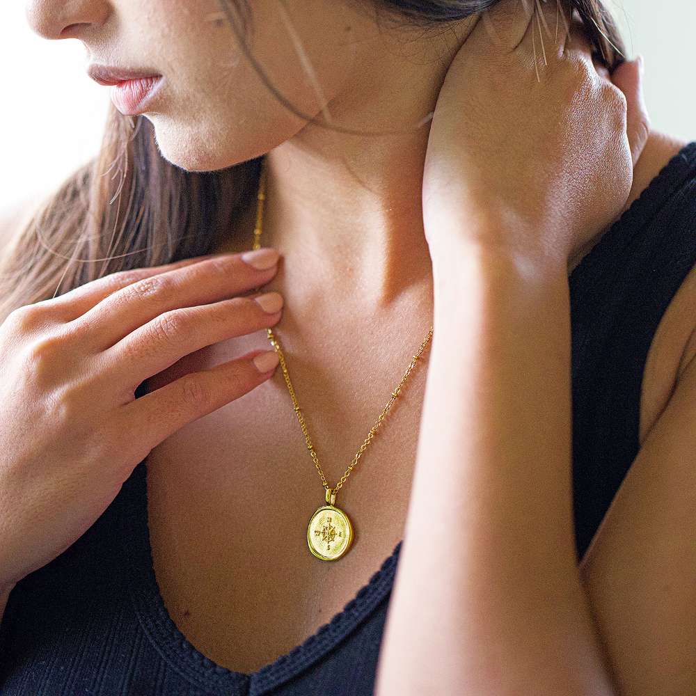 Gold compass necklace